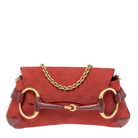 gucci vintage horsebit clutch|Gucci red embossed clutch.